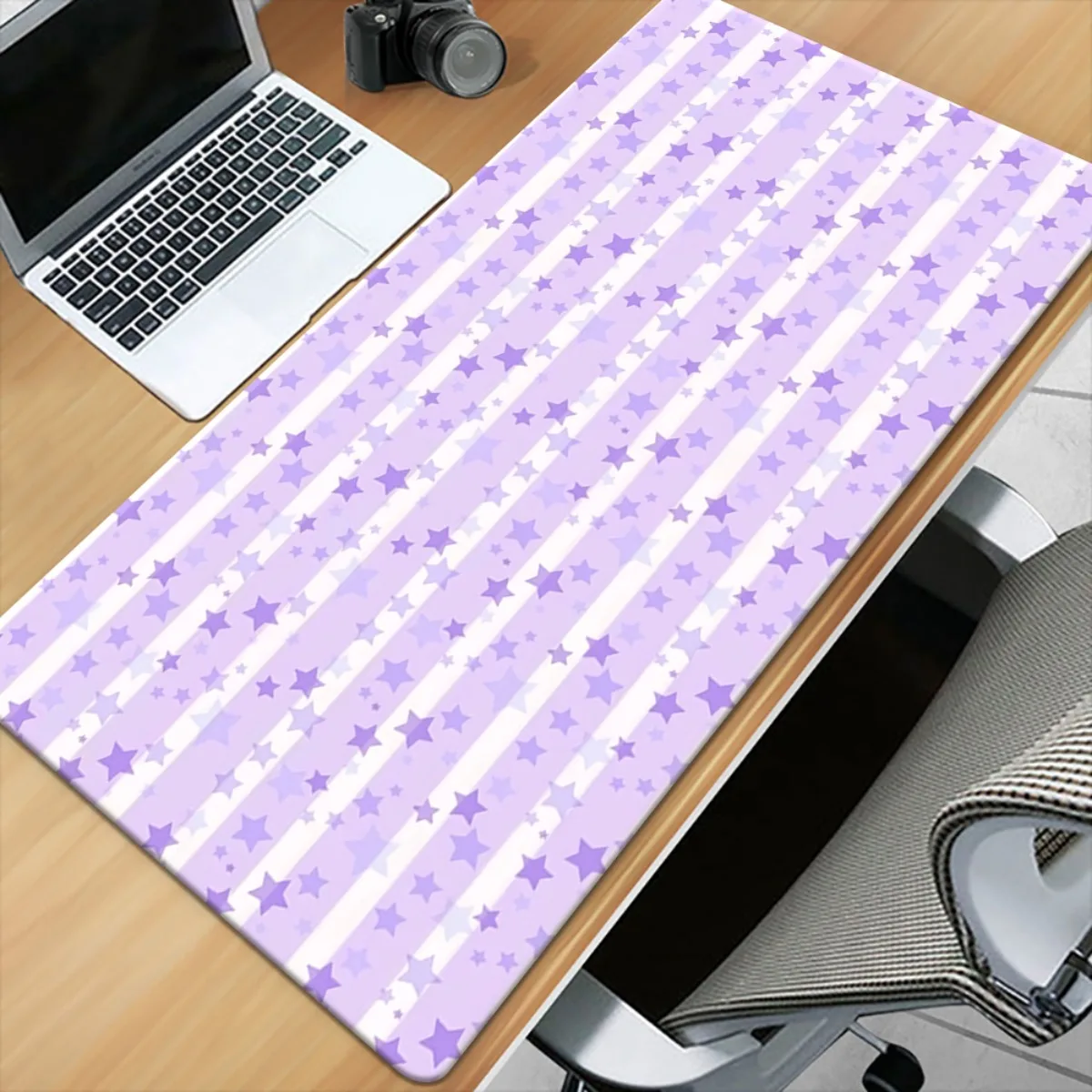 

The light purple star-patterned mousepad has an anti-slip surface made of rubber and is washable for computer desktop decoration