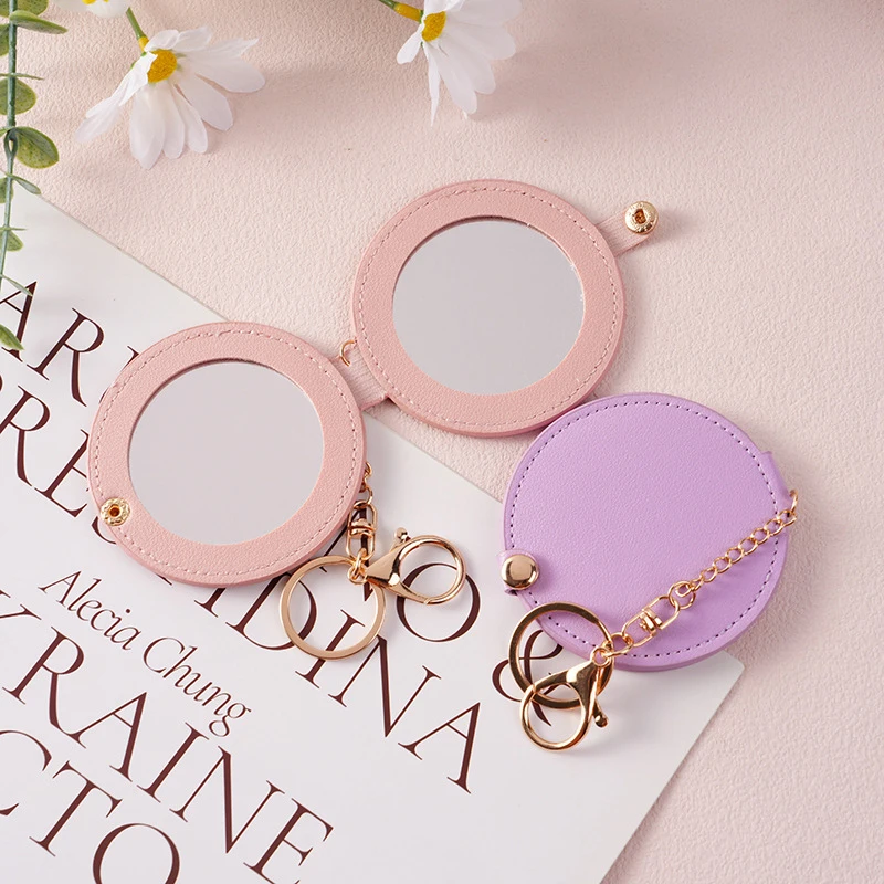 PU-leer Ultradunne ronde make-upspiegel Roestvrij staal Dubbelzijdige cosmetische spiegel Opvouwbare zak Compacte spiegel voor op reis