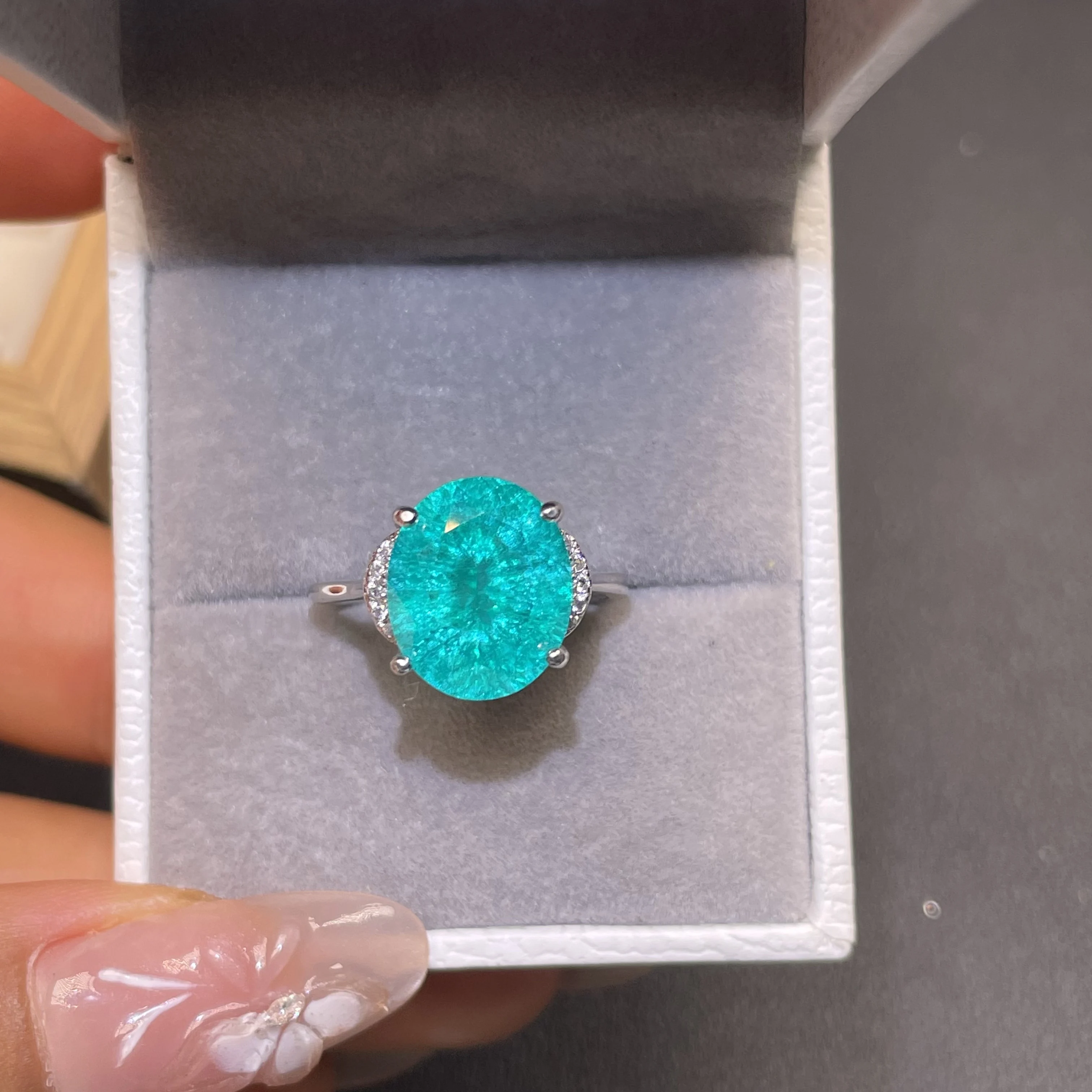 Paraiaba ice crack 8ct oval gemstone four-prong silver ring - a must-have fashion item for a proposal party