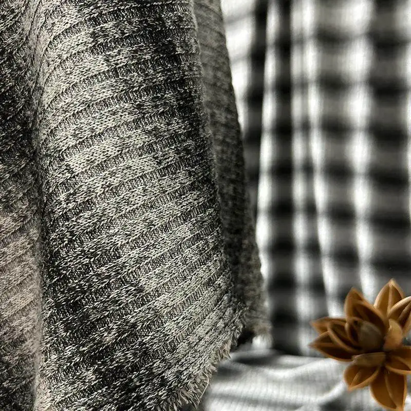 

Yarn Dyed Black White Gradually Striped Knitted Fabric for DIY Sewing Base Layer Dress Clothing Fashion Wholesale Cloth