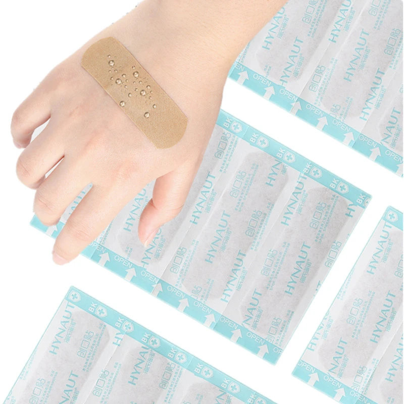 Impermeável adesivo Woundplast emplastros, band-aid, tiras de primeiros socorros, ferida vestir remendo, respirável, 100pcs por conjunto