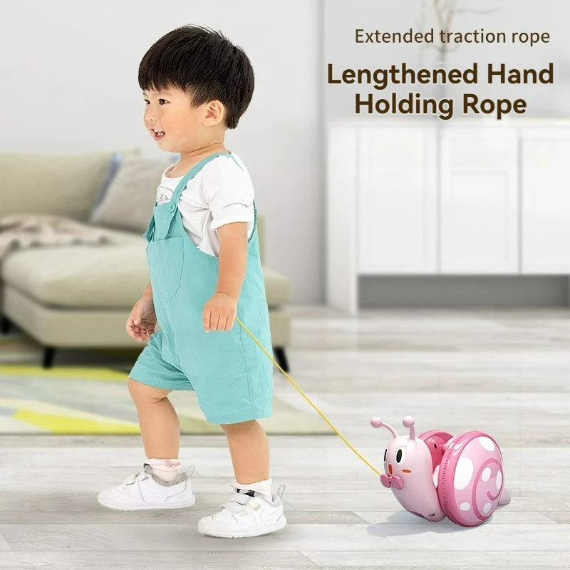 Nova corda caracol brinquedo crianças puxar corda puxando bebê rastejando aprender a andar som e luz quebra-cabeça meninos meninas brinquedo