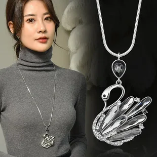 Nuovissima catena maglione cigno, ciondolo cigno occhio di gatto femminile, collana lunga autunnale e invernale, accessori eleganti e versatili