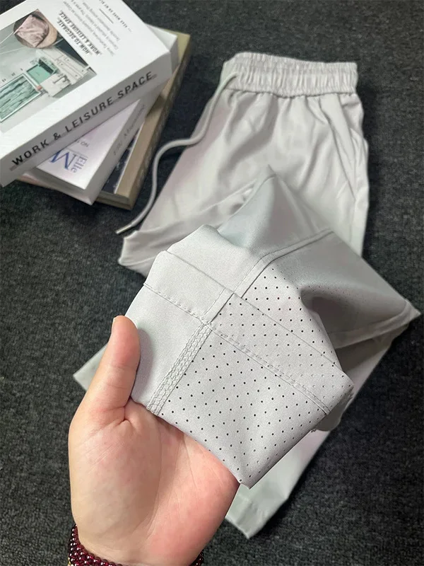 

Мужские летние тонкие спортивные повседневные брюки из ледяного шелка с лазерной перфорацией, дышащие, легкие, прямого кроя