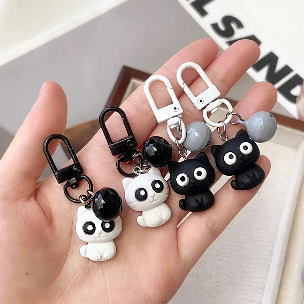 Porte-clés chat Big Eyes avec cloche, pendentif minou, étui pour écouteurs, décor de sac à dos, cadeaux de navire, noir et blanc, document, mode