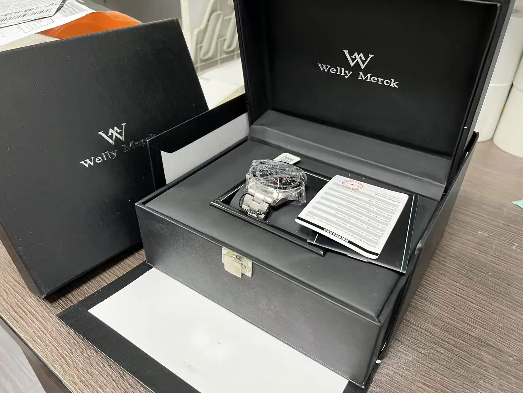 Welly Merck Watch Box – Matte Black Exterior, Silver - Tone Clasp, Branded Interior, Sleek & Sophisticated, Designed for Premium