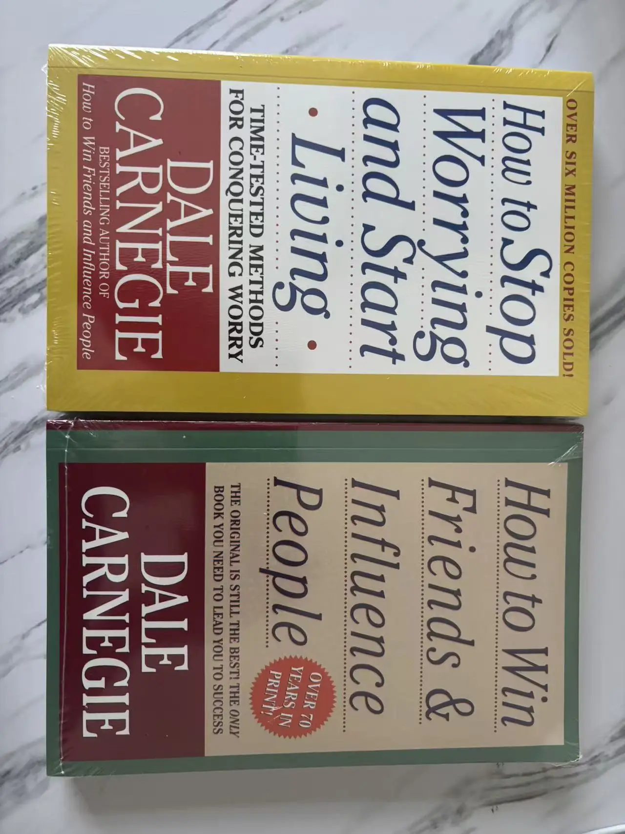 2 books on personal strengths, how to win friends and influence others, and an eternal self-help guide for personal growth