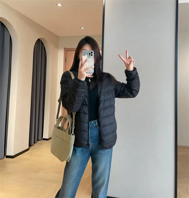 Giacca imbottita leggera da donna stile corto outdoor casual 90% piumino d'anatra bianca stile gilet tessuto in nylon chiusura con cerniera con cappuccio