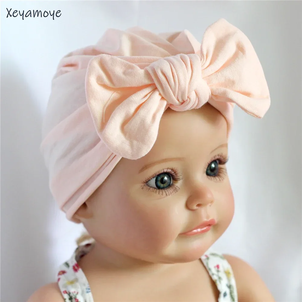 

Хлопковая однотонная шапка-бини для новорожденных, тюрбан с бантом для маленьких девочек, повязка на голову с милым бантом, тюбетейка для новорожденных, больничные теплые шапки Bebes