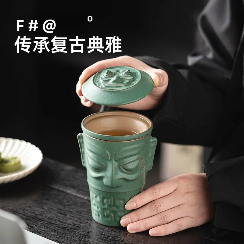 

Sanxingdui Bronze Mask Teacup Office Tea Separation Mug with Lid Cultural Creativity Home Ceramic Personal Coffee Water Cup Gift