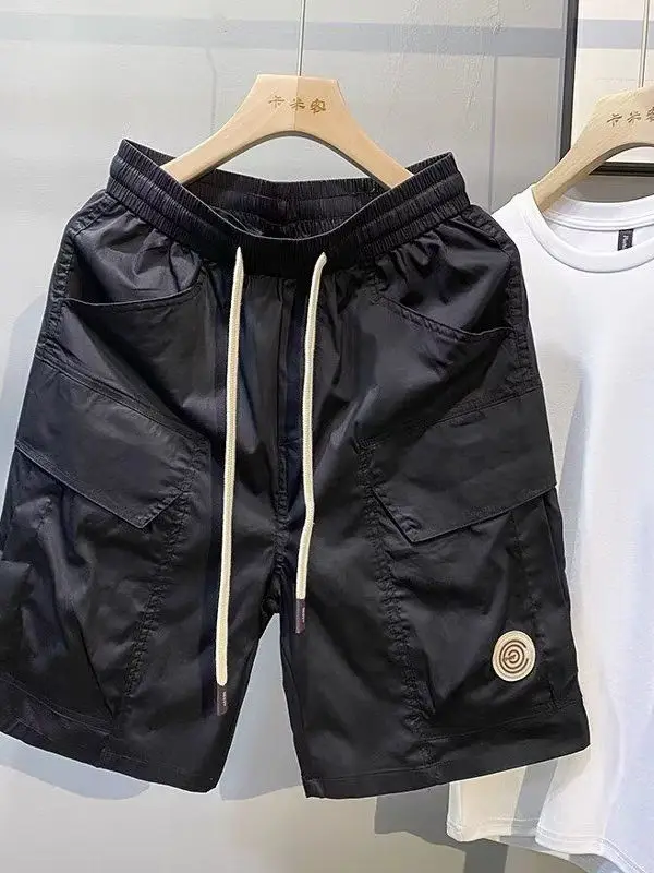 سراويل قصيرة عصرية للعمل للرجال صيفية بنمط جديد وسيم فضفاض بخصر مطاطي مستقيم الساق سراويل غير رسمية بخمسة أرباع