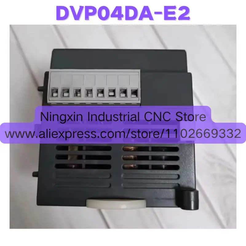 

Second-hand DVP04DA-E2 PLC Expansion Module Tested OK