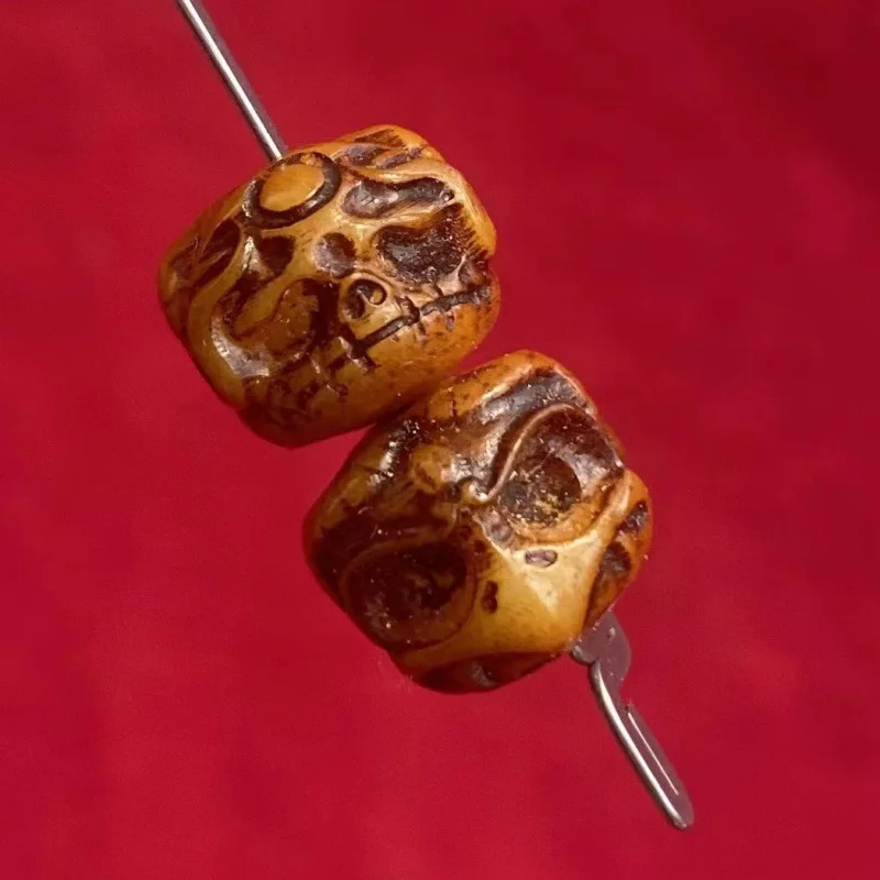 Tibetan-style, handcrafted, solid-carved double-sided carving of ox and camel bones featuring a 