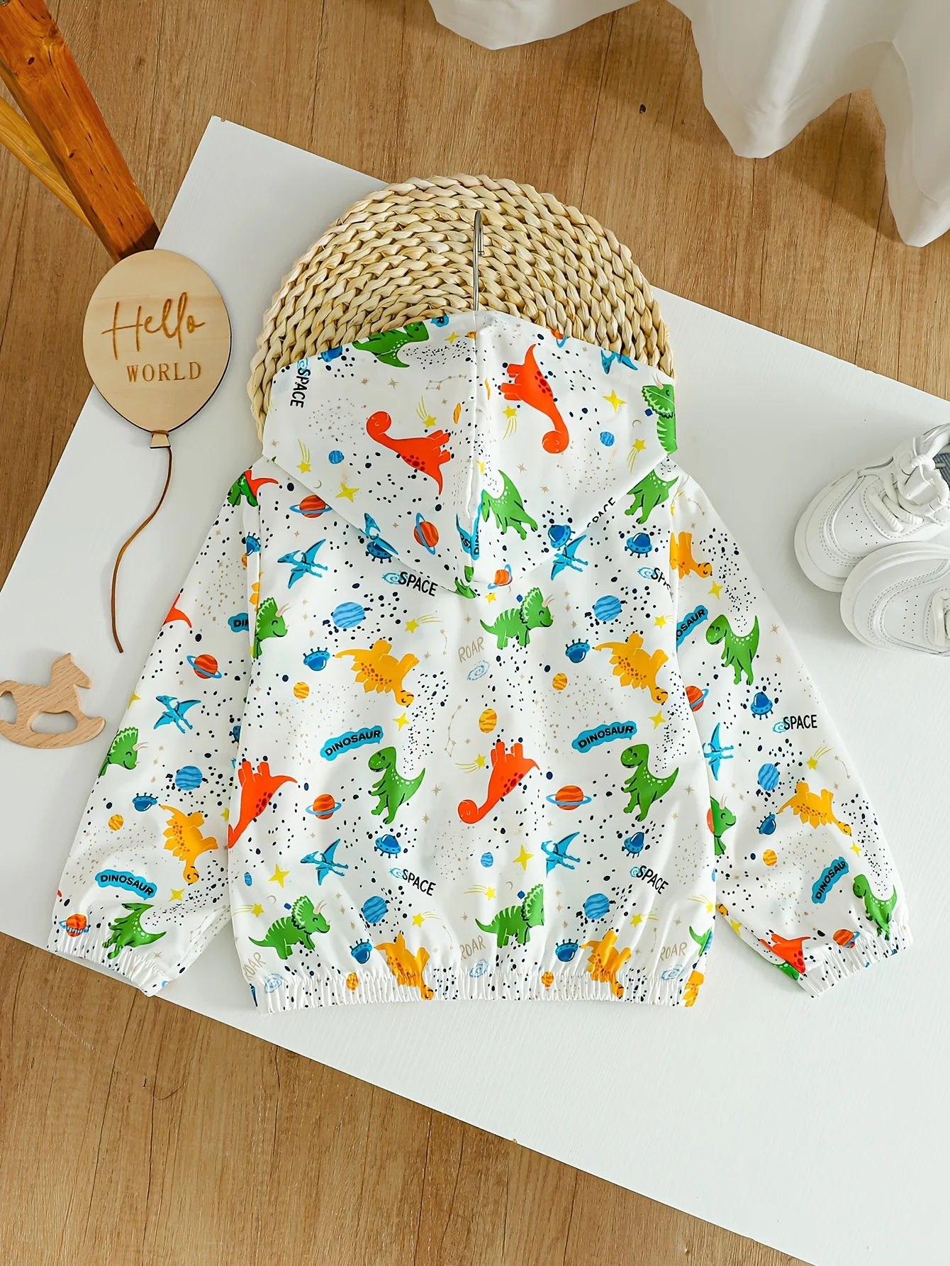 Girls' casual hooded jacket featuring a cartoon dinosaur and planet print—perfect for school and outings.