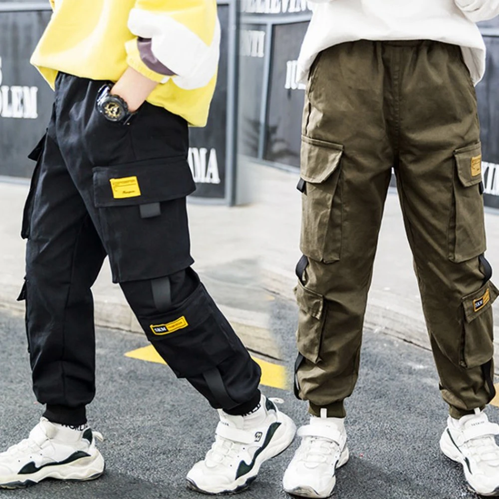 Nuovi pantaloni Cargo laterali con nastro adesivo per bambini pantaloni Cargo neri kaki per adolescenti stile sciolto pantaloni sportivi classici