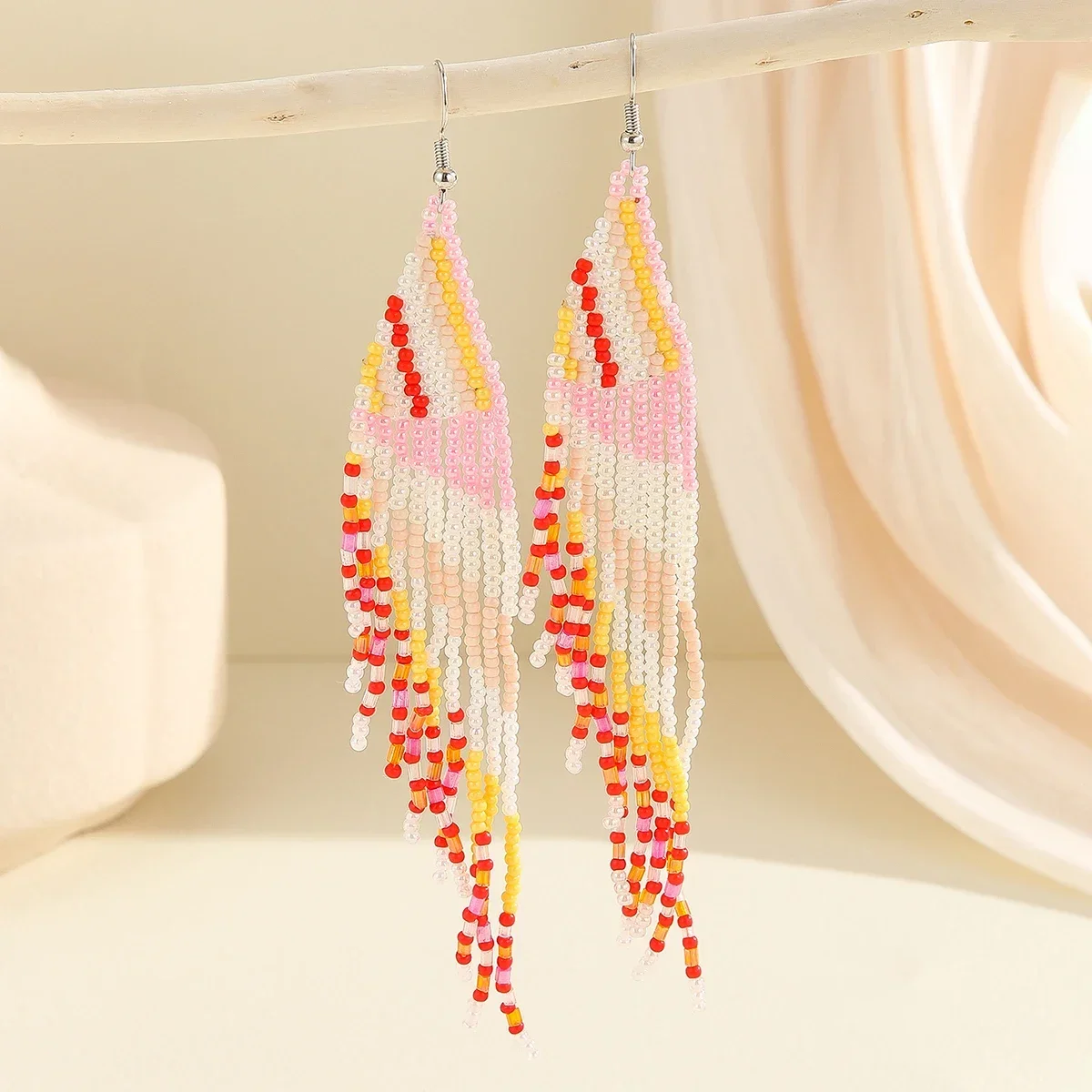 ZGMXR Rice bead earrings Tassel  Retro Tide Hand knitting Alloy Bohemia Design Originality Symmetry Heart Female Beaded earrings