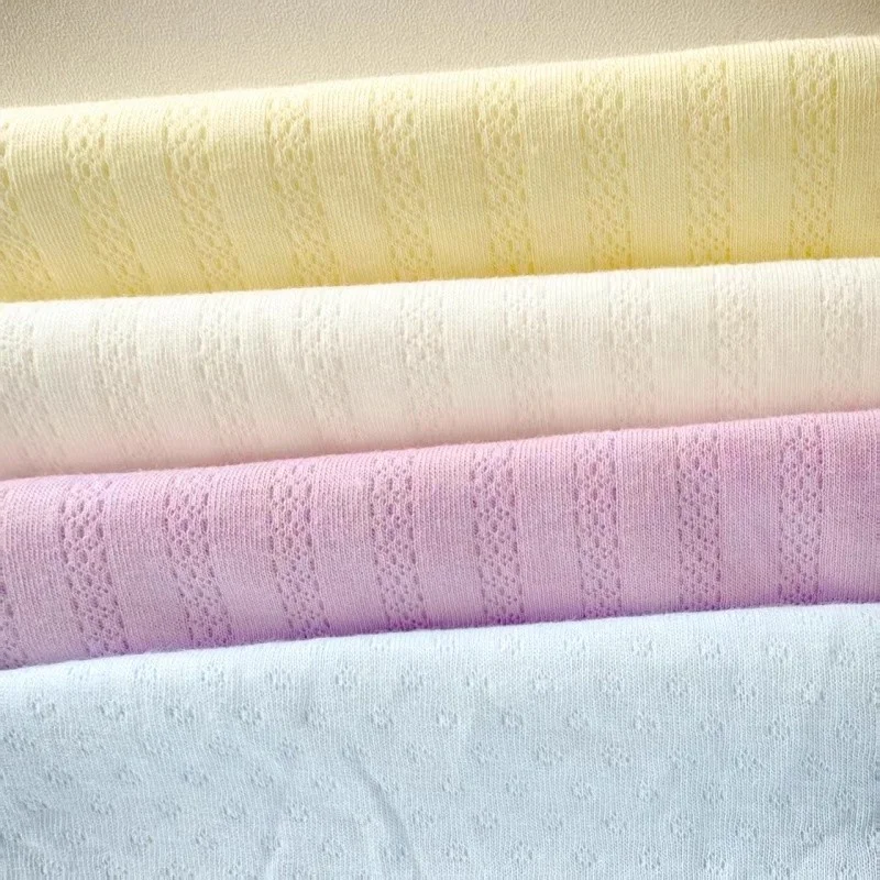 

Double-layer jacquard knitted fabric made of pure cotton. Children's underwear. Blue, yellow, white and orange. Handmade fabric.