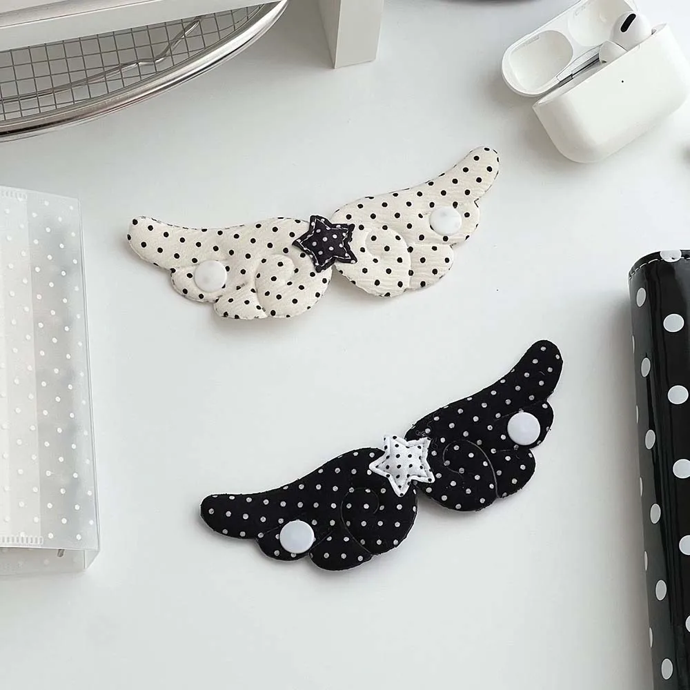 Nuevo organizador de cables con diseño de ala de ángel, enrollador de cables antienredos para auriculares y cables de carga, soporte portátil para cables