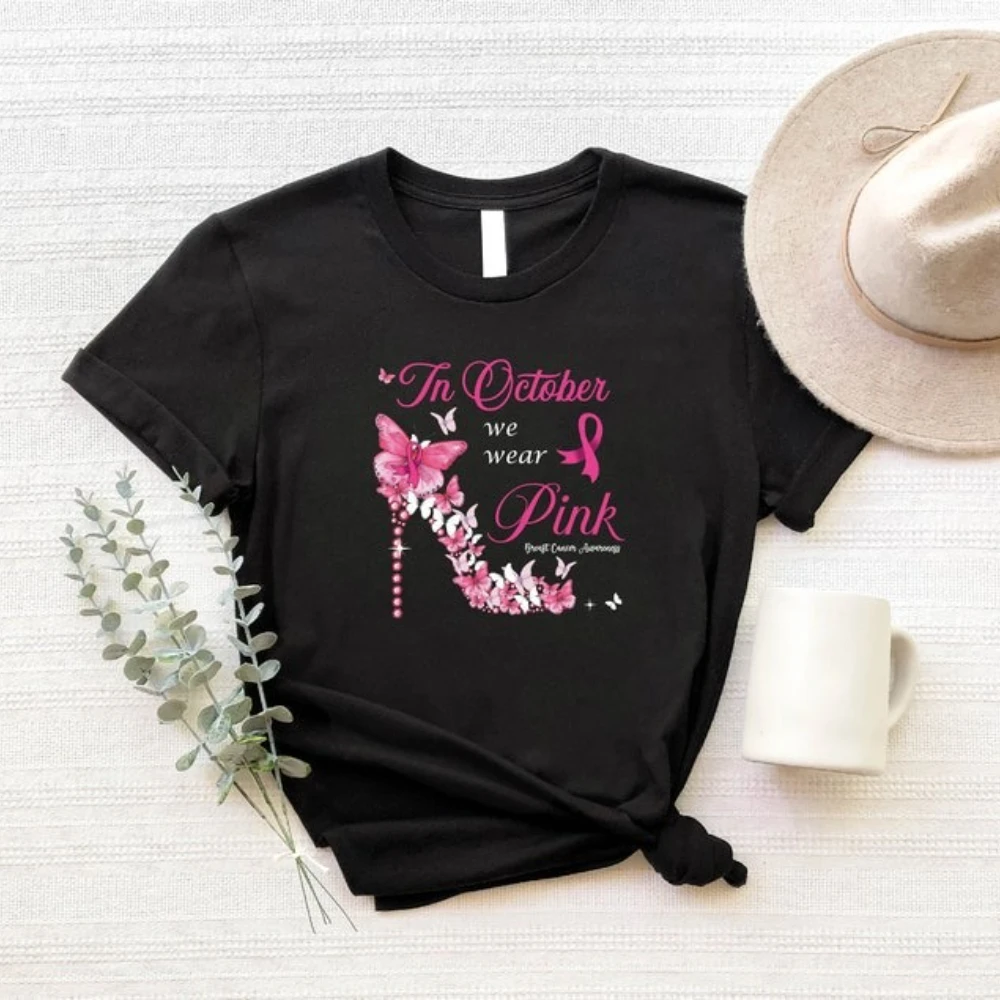เสื้อรณรงค์มะเร็งเต้านม สไตล์ทันสมัยในเดือนตุลาคม เราสวมเสื้อยืดสีชมพู ริบบิ้นมะเร็ง เสื้อผ้าผู้หญิง วันริบบิ้นสีชมพู เสื้อผ้าสตรีทแวร์