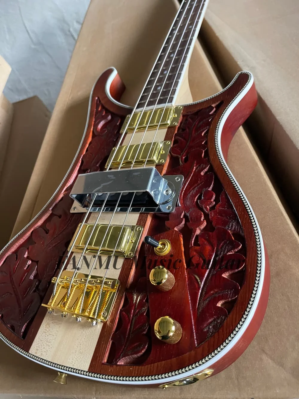 4 strings carved matte red-brown guitar, gold bass bridge, maple neck  through ASH wood body, engraved patterns,four pickups