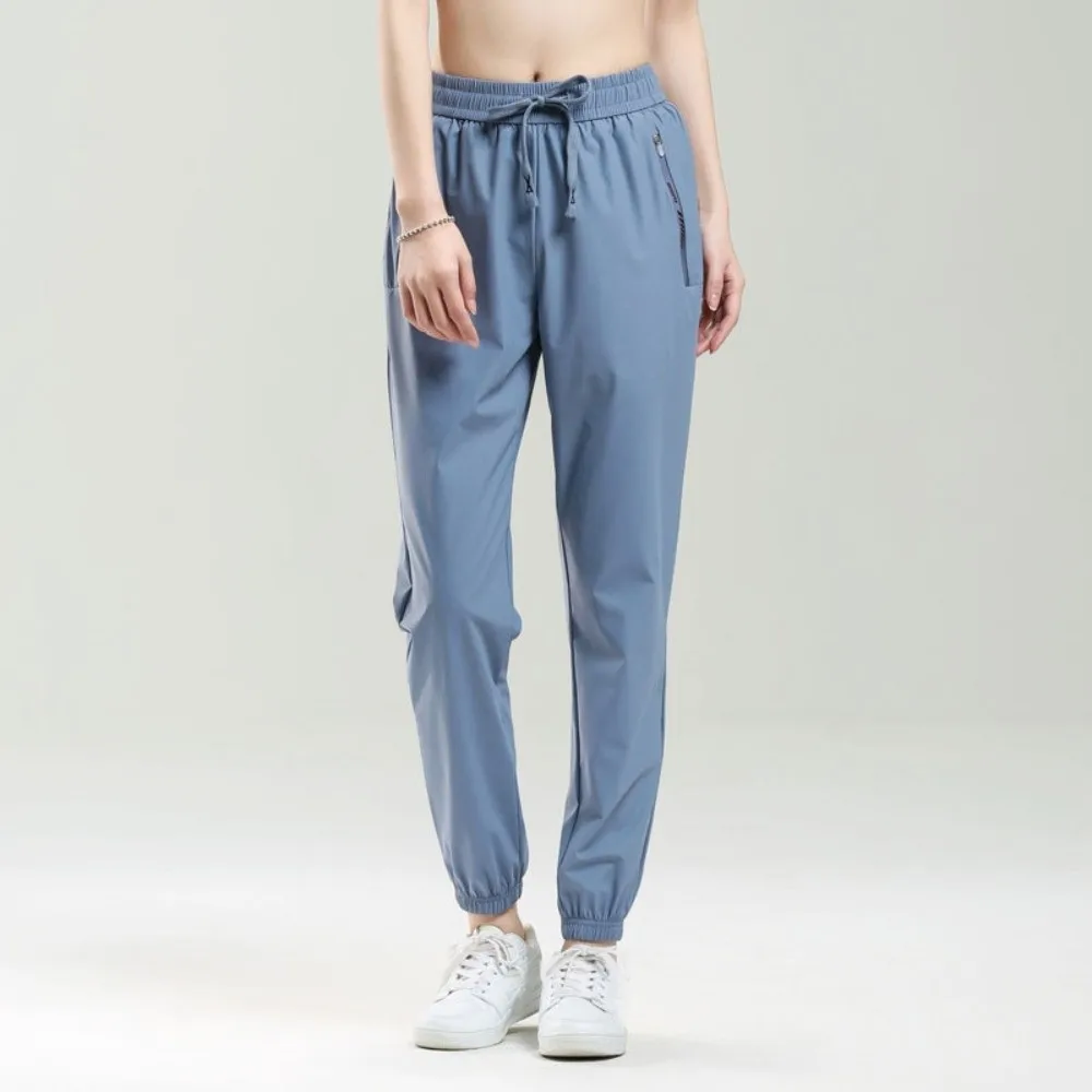 

Slimming Ice Silk Sports Pants Loose Tapered Running Pants Zip Pocket Stretchy Fitness Pants Running