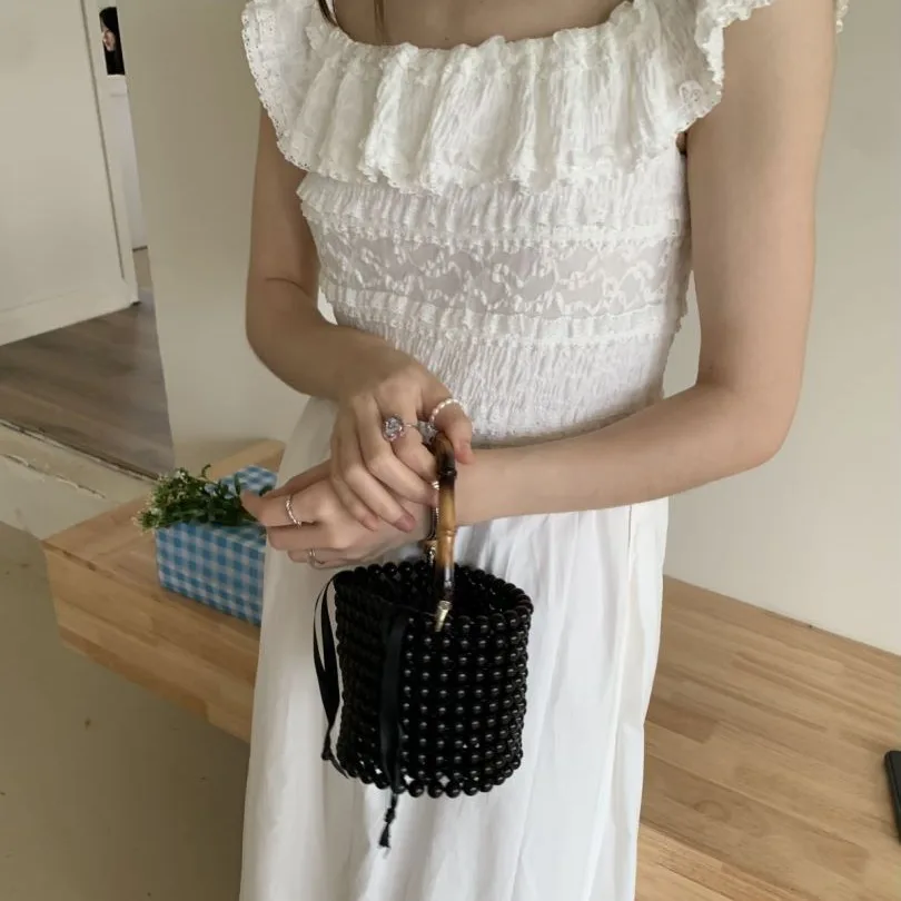 Bolso de perlas con asa de bambú, bolso de lujo con cuentas para fiesta de noche, bolsos de diseñador, bolso de cubo tejido hueco, embrague de boda hecho a mano, nuevo