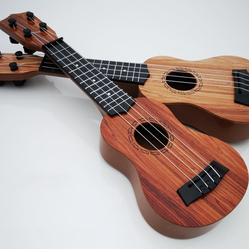 Grundschul-Musikgitarrenspielzeug für Kinder mit Paddeln, simuliertes Ukulele-4-Saiten-Instrument