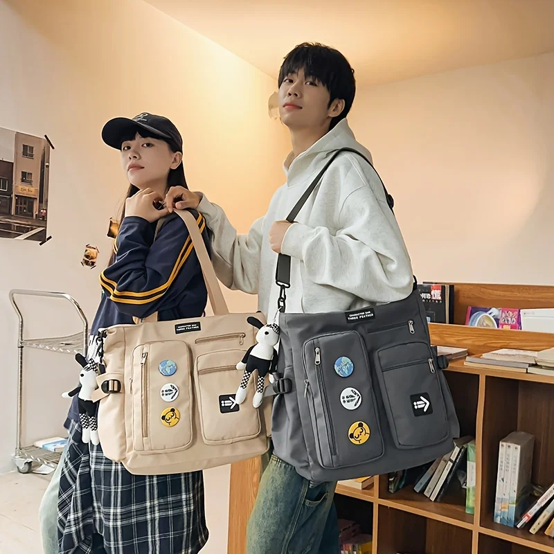 

A large capacity Oxford cloth casual shoulder bag with multiple pockets for men.