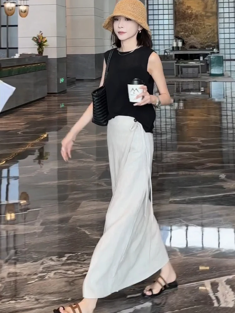 กระโปรงทรงเอเอวสูงความยาวปานกลางสำหรับผู้หญิง สไตล์ลำลองช่วงฤดูร้อน ช่วยให้ดูผอมเพรียว ดีไซน์ผูกเชือก ผ้าลินิน ผ่าข้าง เหมาะสำหรับใส่ทำงาน