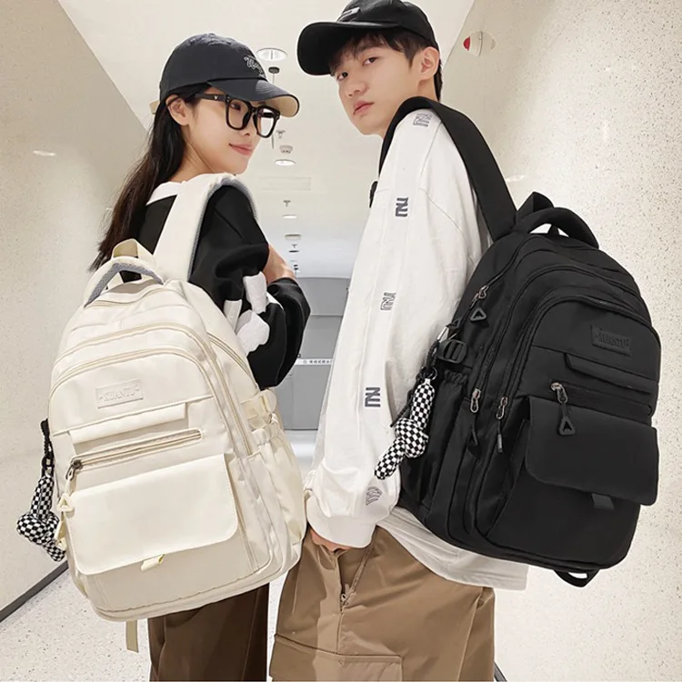 2024 Simple student bag solid color schoolbag With pendant large capacity travel backpack High quality canvas school bag bookbag