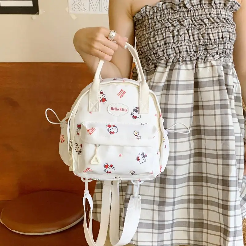 حقيبة ظهر Sanrio الجديدة المطبوعة برسوم كارتونية HelloKitty حقيبة ظهر عصرية كاجوال للفتيات Kawaii حقيبة كروس محمولة على ظهره للطلاب
