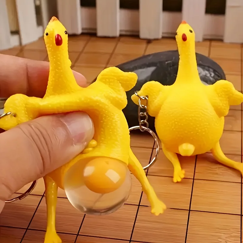 2 packs of fun keychains, novelty squeeze egg-laying chicken toy key ring, surprise soft and cute children's toys,random colors.