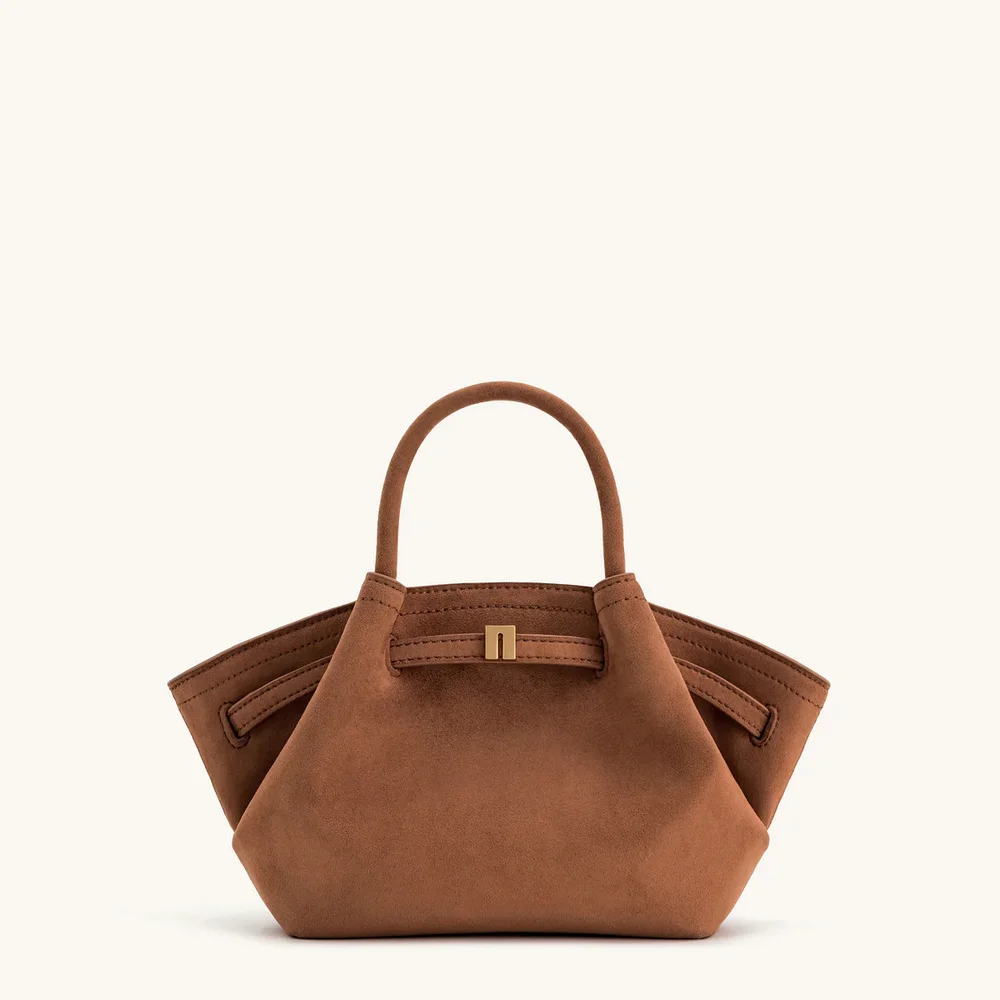 

Dumpling-shaped suede shoulder bag with a unique design, handheld or tote style, suitable for commuting and cross-body carrying