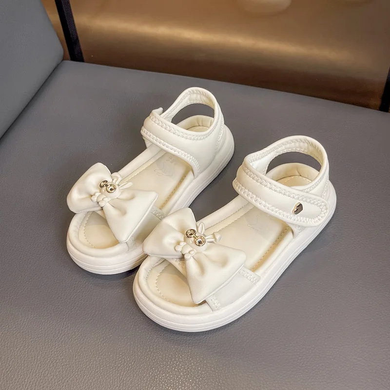 

2024 New Children's Sandals Girl Solid Color Summer Princess Cute Rabbit Beach Sandals Fashion Bowtie Kids Causal School Sandals