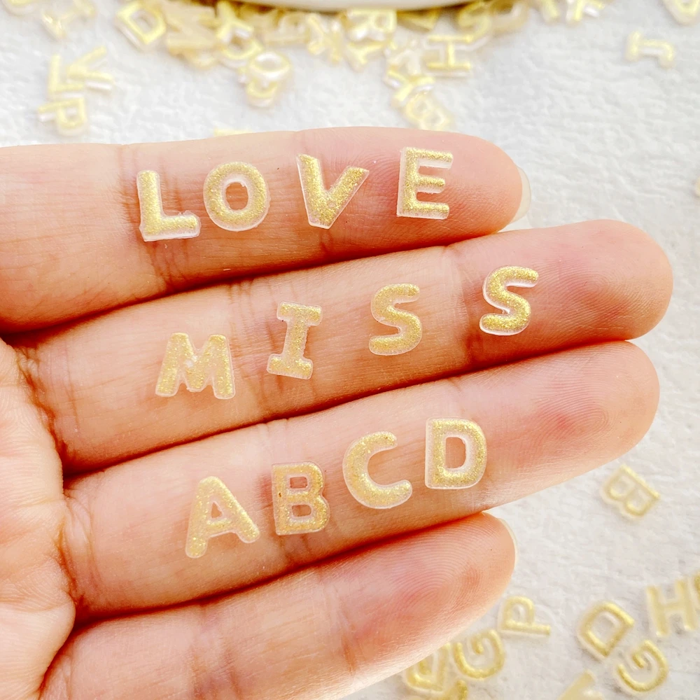 200 pçs resina mista mini dhining 26 letras douradas arte do prego parte traseira plana pedra apliques diy encantos de natal scrapbook decoração artesanato