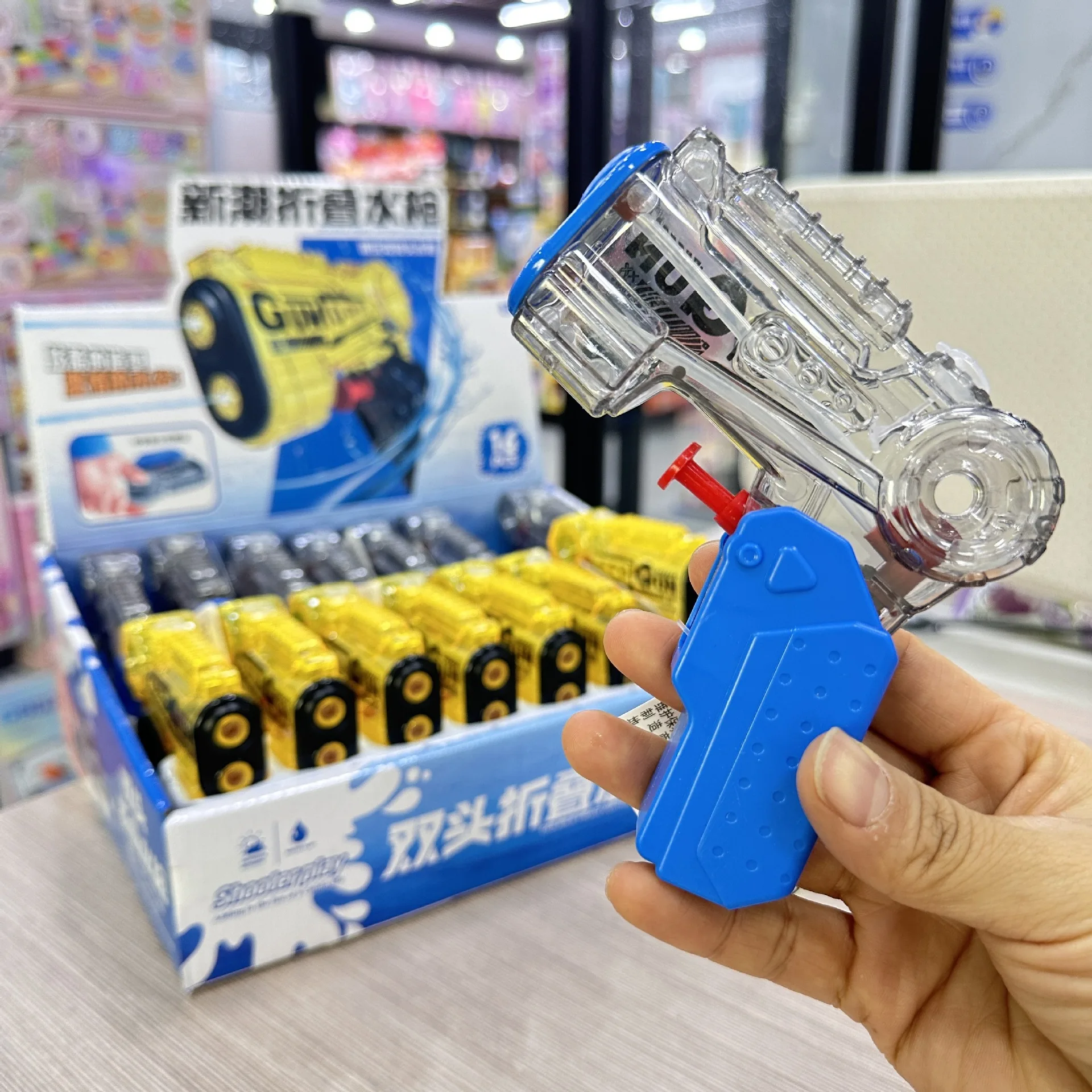 pistola-de-agua-plegable-de-doble-cabezal-transparente-al-por-mayor-pistola-de-agua-portatil-para-actividades-de-verano-al-aire-libre-y-piscina