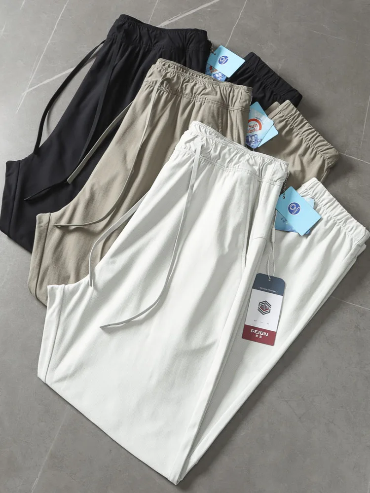 

Крутые повседневные брюки с лазерной пирсинкой и эластичной резинкой на талии, мужские летние свободные брюки прямого кроя, дышащие, удобные, модные