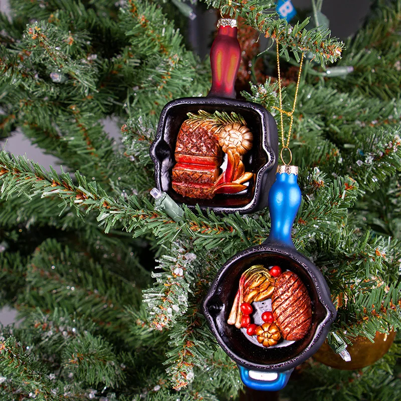 Two Christmas glass ornaments with flat bottomed pans