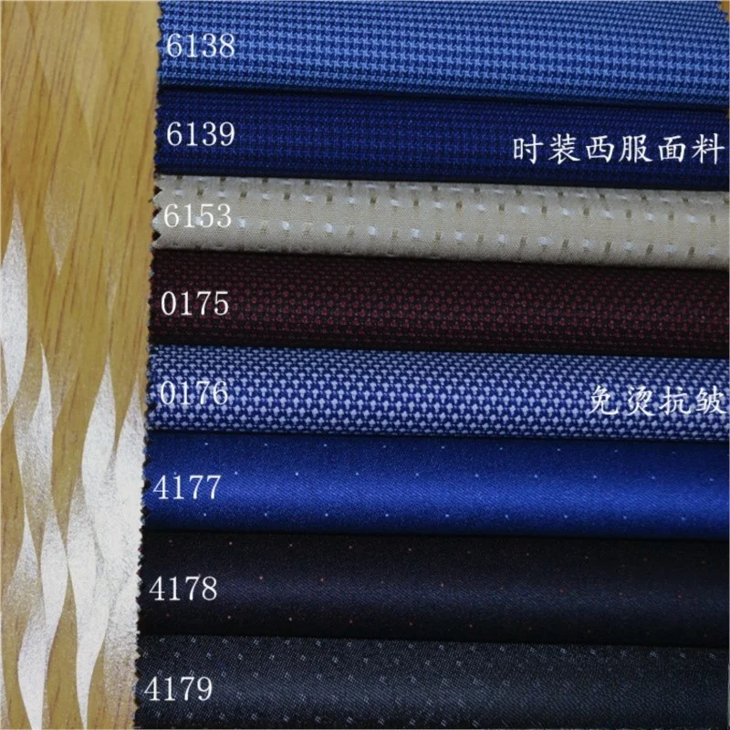 

The fabric of fashion suit is blue beige dark red with small checks and black deep dots It a set formal dress