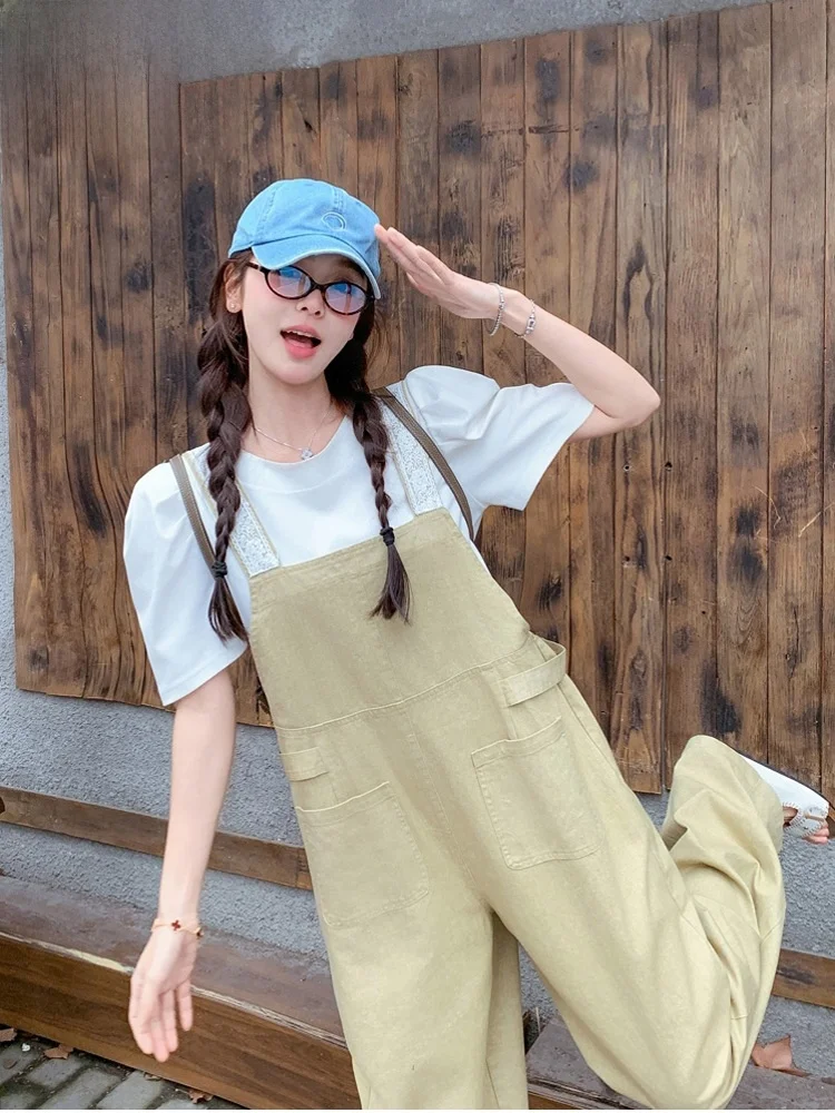 จั๊มสูททำงานสีกากี แต่งขอบลูกไม้ สไตล์ลำลองสำหรับผู้หญิง ฤดูร้อน หวานซ่อนเปรี้ยว ดูอ่อนเยาว์ กางเกงขายาวเอวสูงทรงขากว้าง