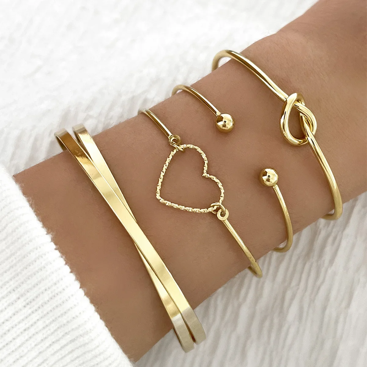 Pulseras abiertas con dijes geométricos para mujer, brazalete de aleación con nudo de corazón de amor, regalos de joyería, 4 piezas por juego