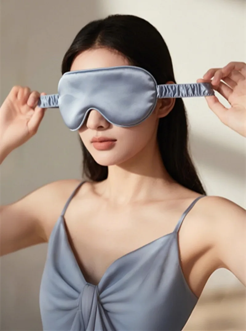 Person wearing the silk eye mask while relaxing