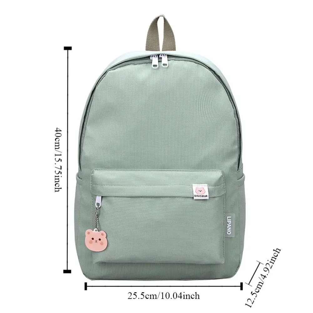 Estudantes à prova dwaterproof água mochila simples lazer saco de escola com pingente dos desenhos animados multi bolso todos os jogos moda sacos ombro duplo