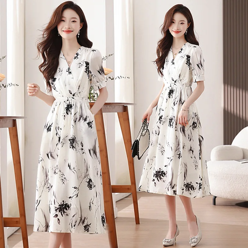Robe à fleurs blanche pour femmes, nouvelle mode d'été, taille de tempérament, haut de gamme, délicate pause thé français, petite jupe longue, 2025