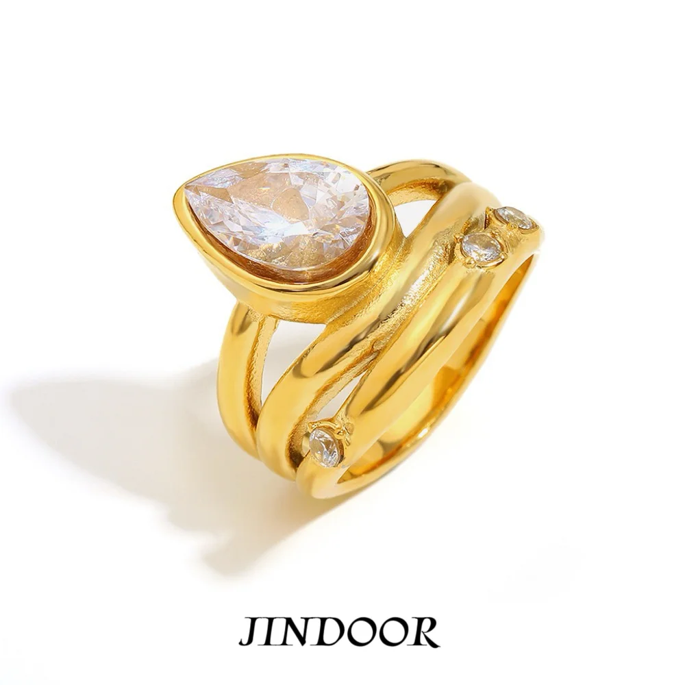 Jindoor 2025 Artisanal Minimalism | Gold-Toned Titanium Ring - Pear-Cut Cubic Z…