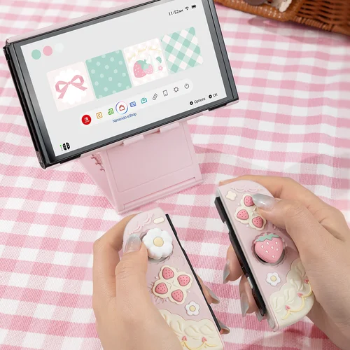 Imagen 2 del producto Funda protectora de silicona Geekshare y funda JoyCon para Nintendo Switch/OLED con 1 par de empuñaduras de pulgar personalizadas, fresa de primavera