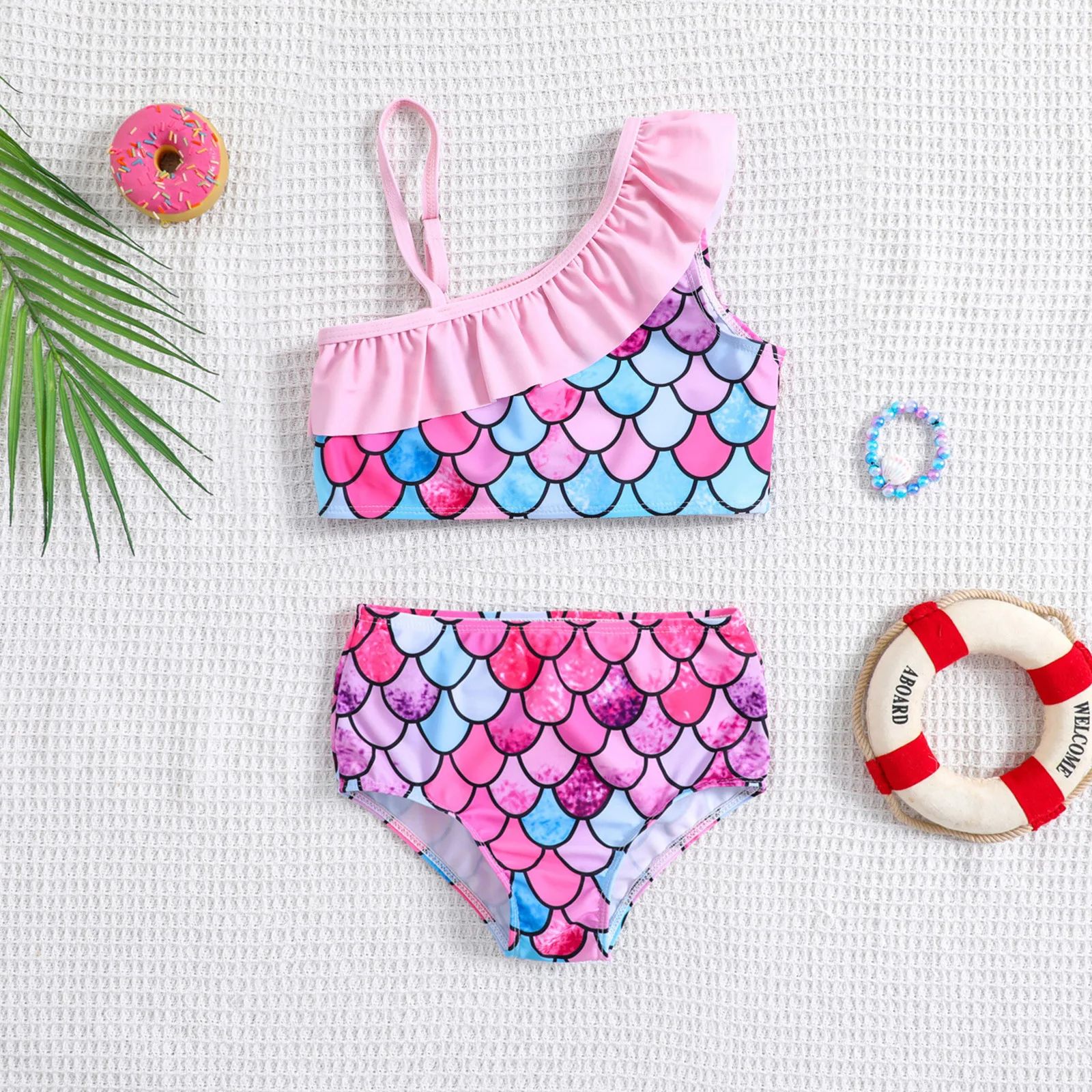Baby two piece swimsuit printed with colorful fish scale pattern suitable for seaside trips and pool water play