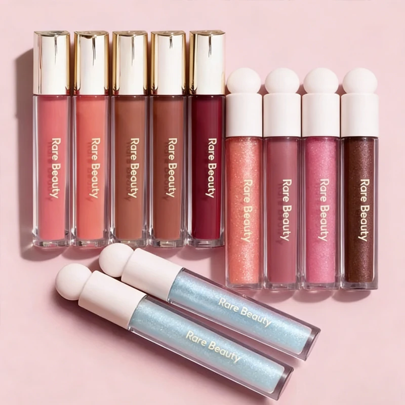

Блеск для губ Rare Beauty Shiny Lip Gloss Spark Beam: Абрикосовый, Нейтральный, Малвовый, Розовый, Ягодный оттенки. Питательная и увлажняющая помада для макияжа губ.