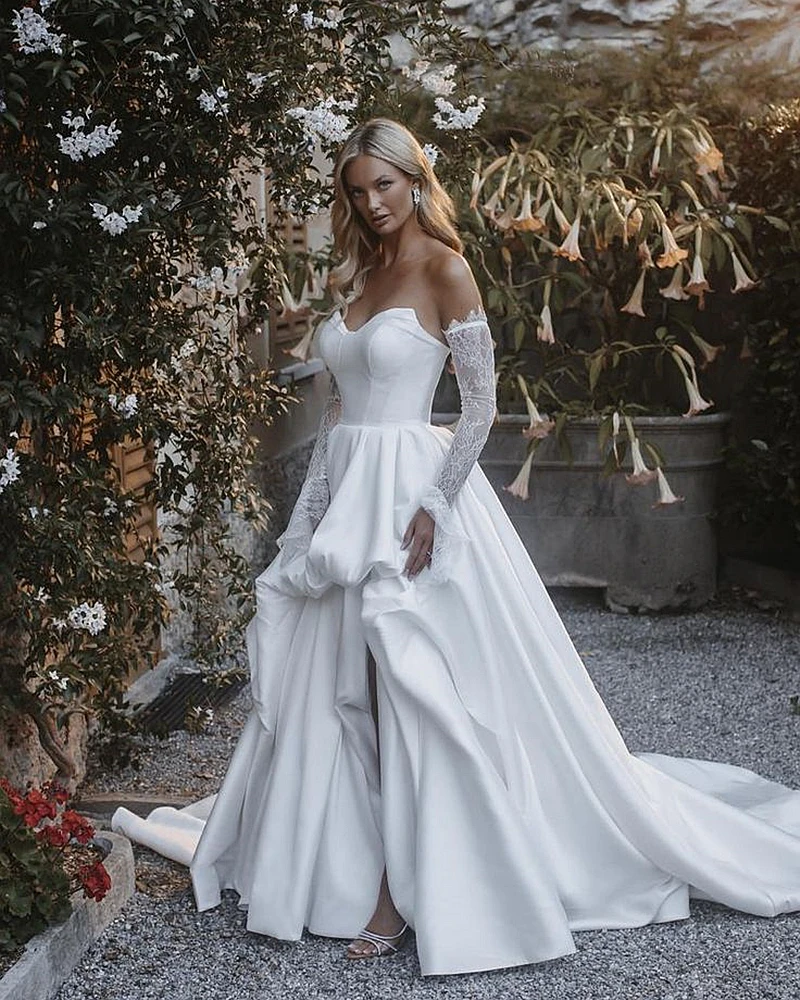 فستان بسيط من الساتان الأبيض على شكل حرف A مع جيوب وأكمام طويلة قابلة للفصل وفتحة جانبية فستان زفاف على الشاطئ للعروس لصيف 2025