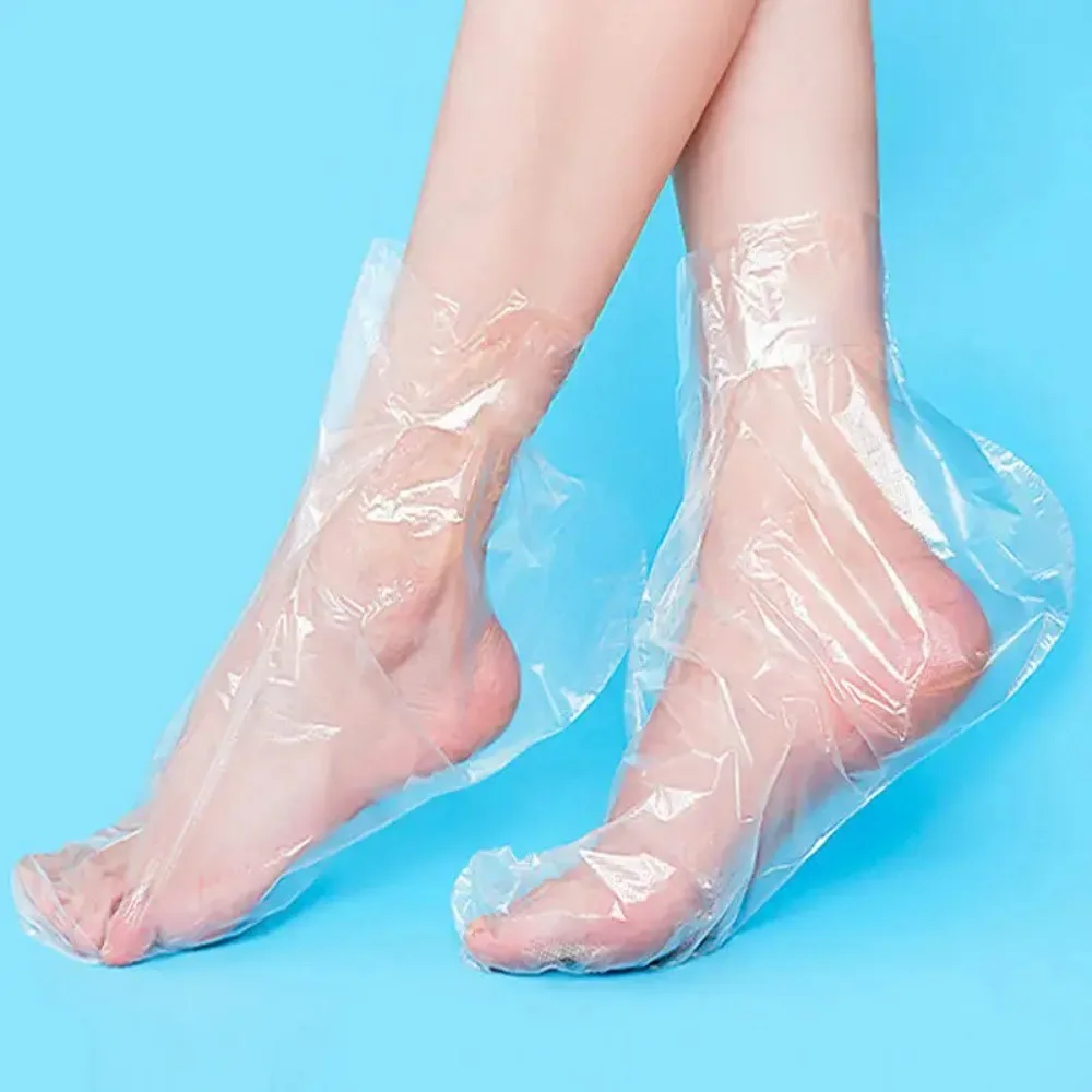 100/200 Uds. Calcetines desechables para hidratar los pies, bolsas transparentes para pies, cubiertas de PE para SPA de pies, removedor de callos, herramientas de pedicura para el cuidado de los pies